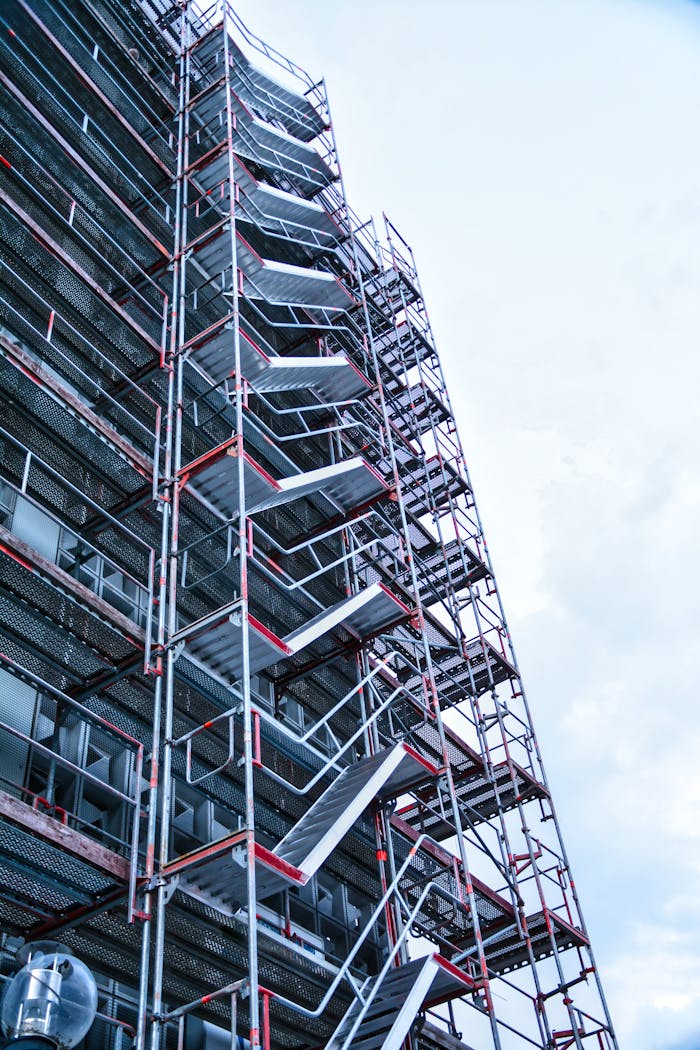 contact-img High-rise building with scaffolding in Osnabrück, Germany, captured from a low angle.